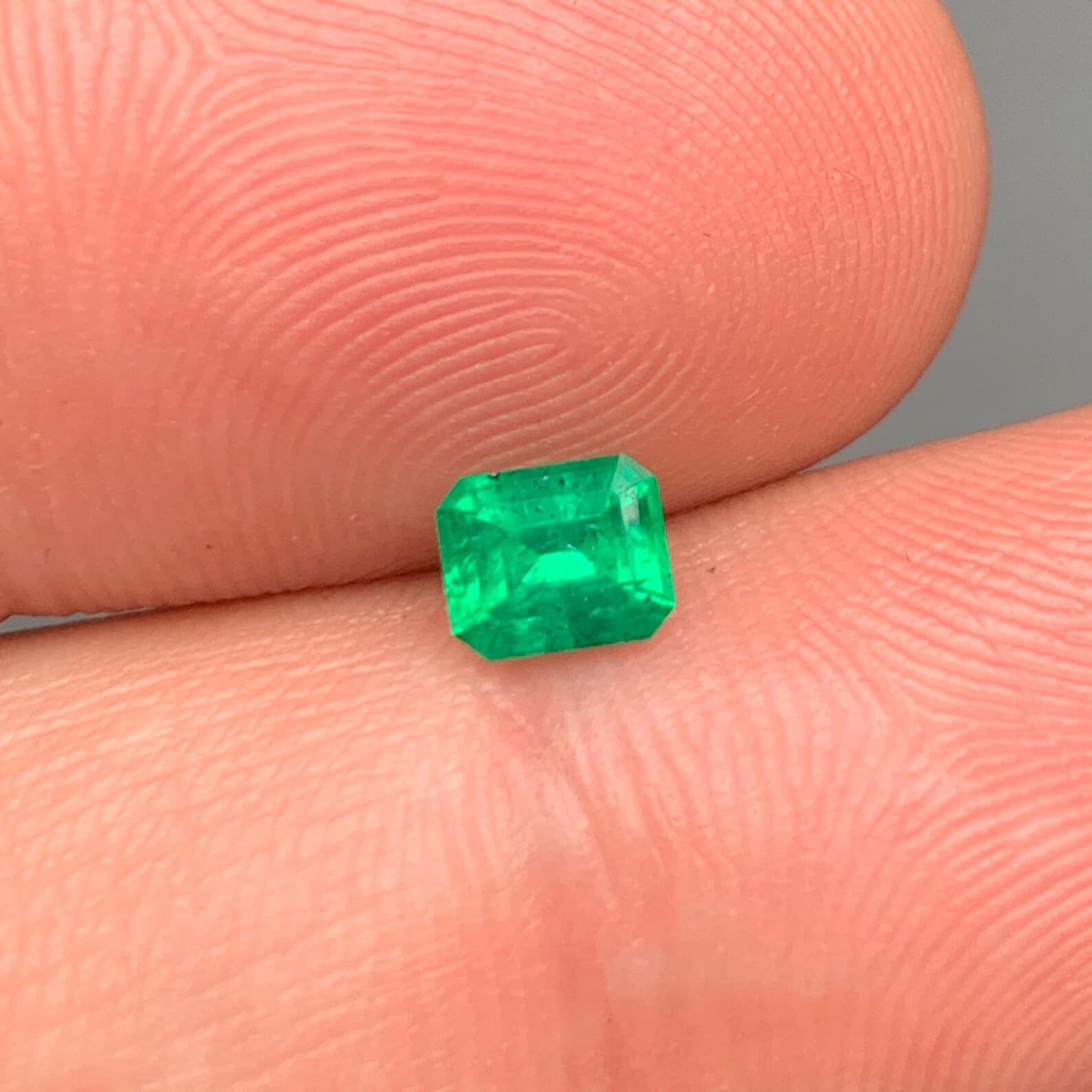 Swat Emerald 0.56ct Emerald Cut, natural green emerald from Swat Valley, Pakistan
